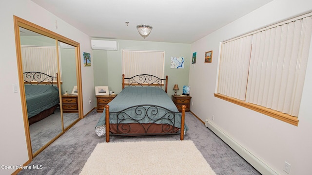 6616 Comanche St, Bonners Ferry, ID 83805 - bedroom featuring an AC wall unit, a closet, carpet, and a baseboard heating unit