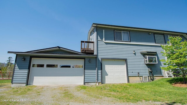 6616 Comanche St, Bonners Ferry, ID 83805 - view of front of house with a balcony and a front lawn