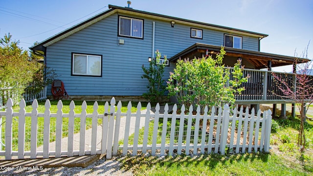 6616 Comanche St, Bonners Ferry, ID 83805 - view of side of property with a lawn and fence private yard