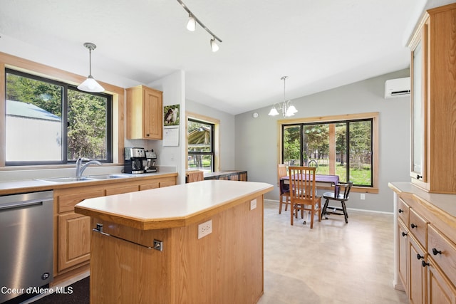 kitchen featuring a sink, light floors, dishwasher, vaulted ceiling, and light countertops