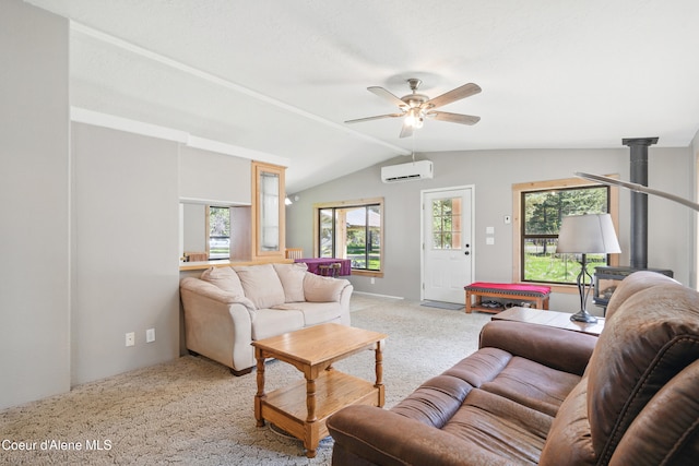 living room with a ceiling fan, an AC wall unit, light colored carpet, and vaulted ceiling