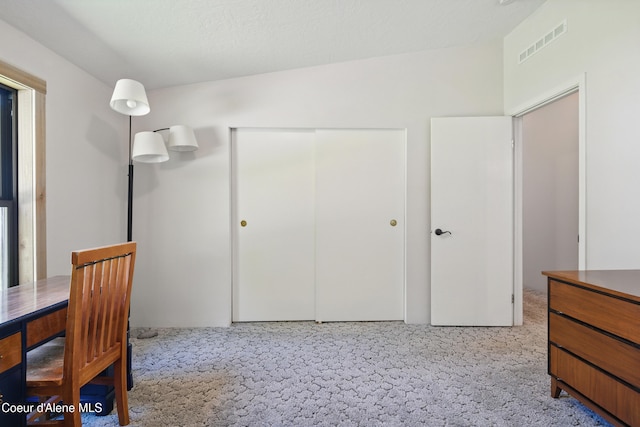unfurnished office featuring visible vents and carpet floors