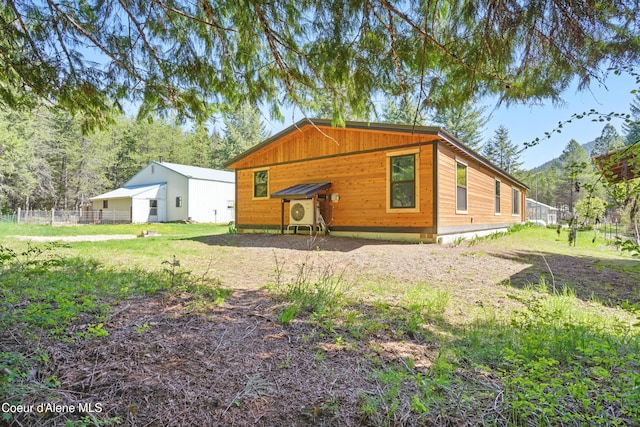 back of house featuring fence