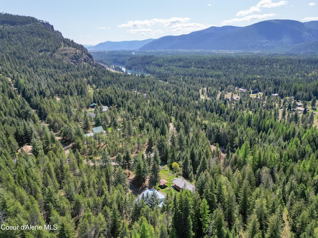 bird's eye view with a wooded view and a mountain view