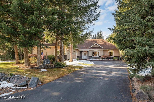 12795 N Yearling Cir, Hayden, ID 83835 - view of front of house with driveway and a garage