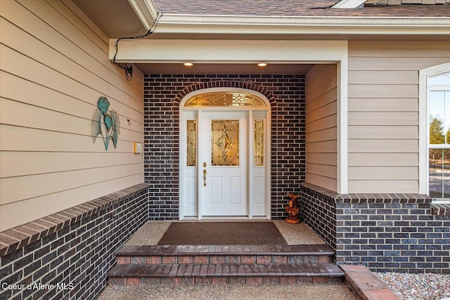 12795 N Yearling Cir, Hayden, ID 83835 - entrance to property with brick siding and roof with shingles