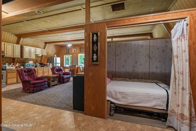 760 Fox Glen Rd, Sandpoint, ID 83864 - bedroom featuring freestanding refrigerator and wooden walls