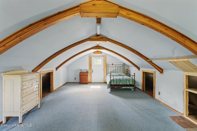 760 Fox Glen Rd, Sandpoint, ID 83864 - unfurnished bedroom featuring carpet flooring, baseboards, and lofted ceiling