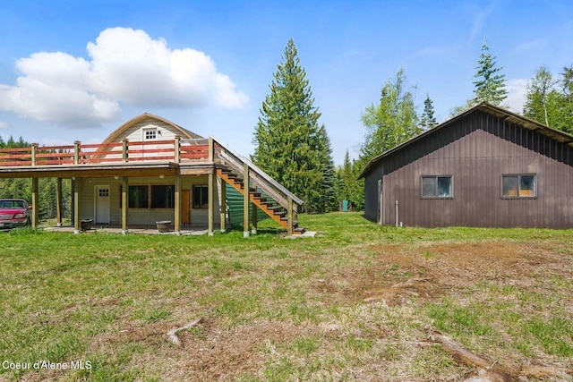760 Fox Glen Rd, Sandpoint, ID 83864 - view of yard featuring stairs and a wooden deck