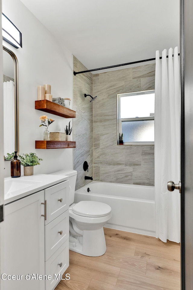 513 Mission Ave, Kellogg, ID 83837 - bathroom with shower / bath combination with curtain, toilet, and vanity