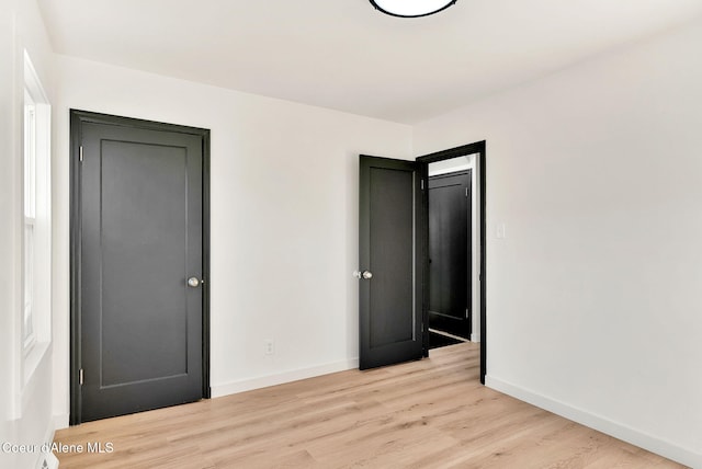 513 Mission Ave, Kellogg, ID 83837 - unfurnished bedroom featuring light wood finished floors and baseboards