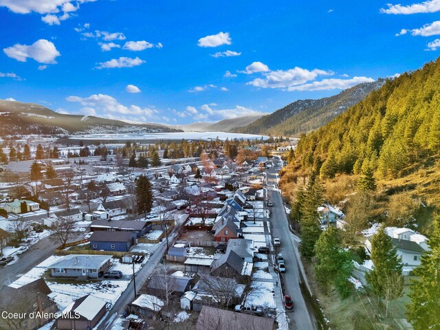 513 Mission Ave, Kellogg, ID 83837 - snowy aerial view with a mountain view and a residential view