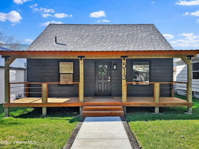 513 Mission Ave, Kellogg, ID 83837 - property entrance featuring a yard and a shingled roof