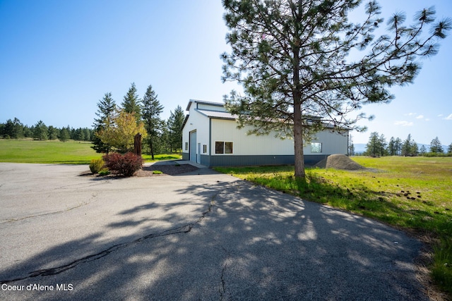 view of home's exterior featuring a lawn
