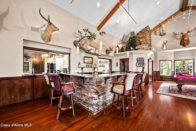 indoor wet bar with high vaulted ceiling, wood finished floors, beam ceiling, billiards, and refrigerator