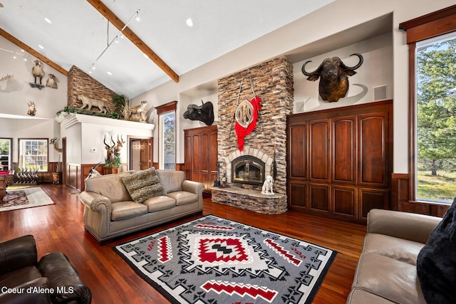 living room with a stone fireplace, high vaulted ceiling, wood finished floors, beam ceiling, and wainscoting