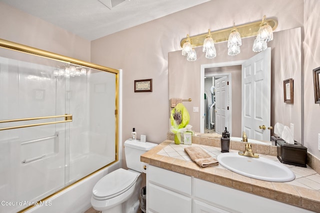 bathroom with shower / bath combination with glass door, toilet, and vanity