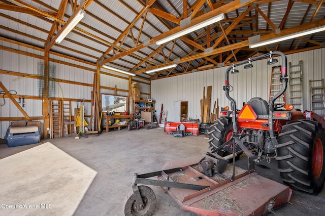 garage featuring metal wall and a workshop area