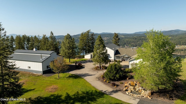 view of subject property featuring a mountainous background