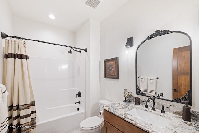 full bathroom with toilet, vanity, and shower / bath combo with shower curtain