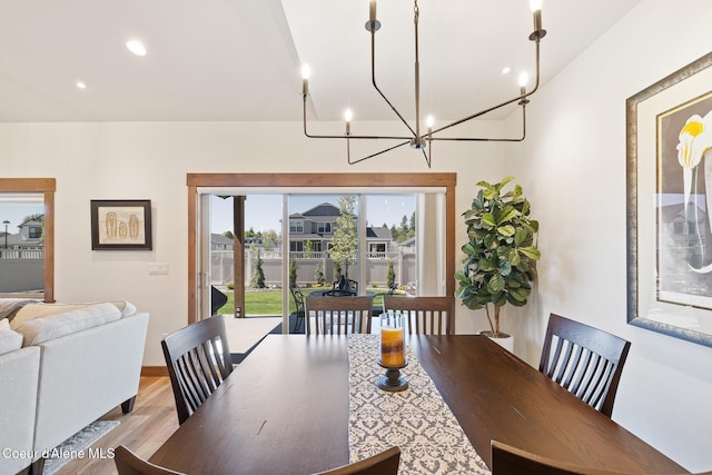 dining area featuring a chandelier, light wood-type flooring, recessed lighting, and baseboards