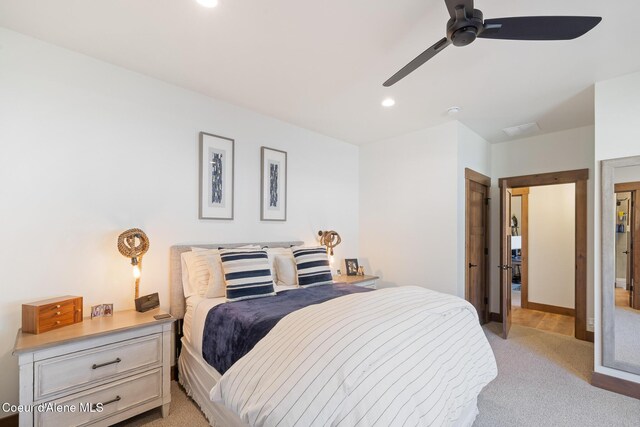 bedroom featuring light colored carpet, recessed lighting, and a ceiling fan