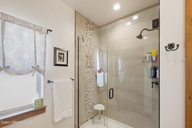 bathroom with a stall shower and recessed lighting