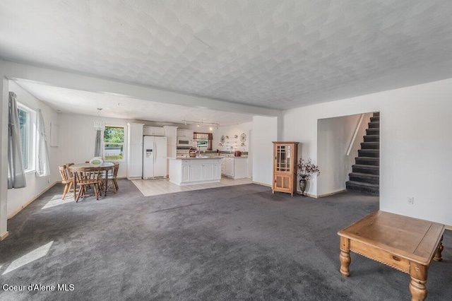 9727 W E St, Worley, ID 83876 - living room with stairs and light colored carpet