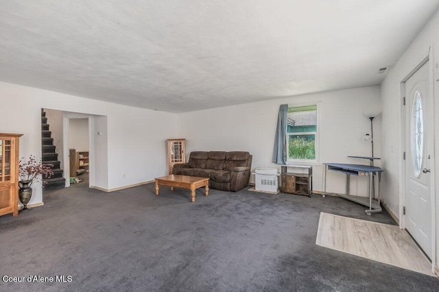 9727 W E St, Worley, ID 83876 - carpeted living area featuring stairs and baseboards