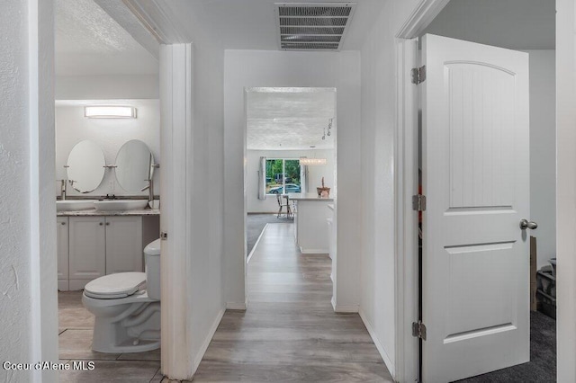 9727 W E St, Worley, ID 83876 - hallway featuring wood finished floors and baseboards