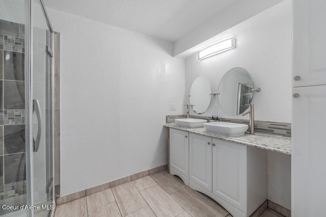 9727 W E St, Worley, ID 83876 - bathroom with double vanity, a stall shower, and a textured wall