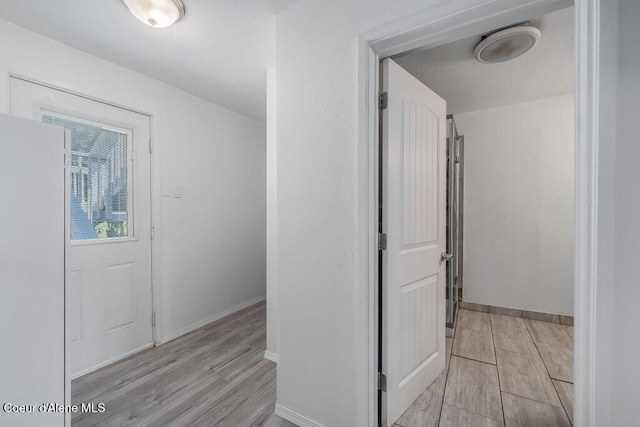 9727 W E St, Worley, ID 83876 - hallway with light wood-style flooring and baseboards