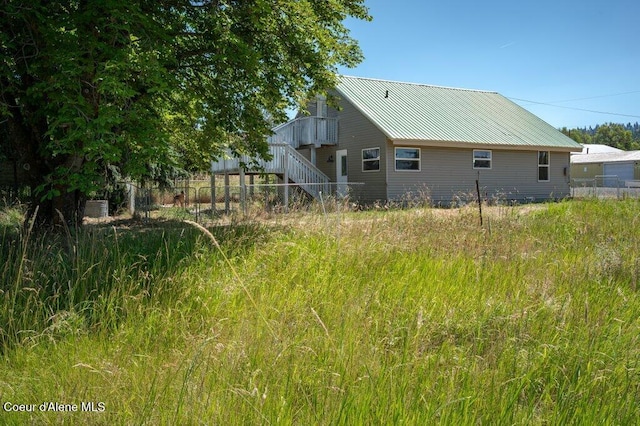 9727 W E St, Worley, ID 83876 - view of side of property with a metal roof and stairs