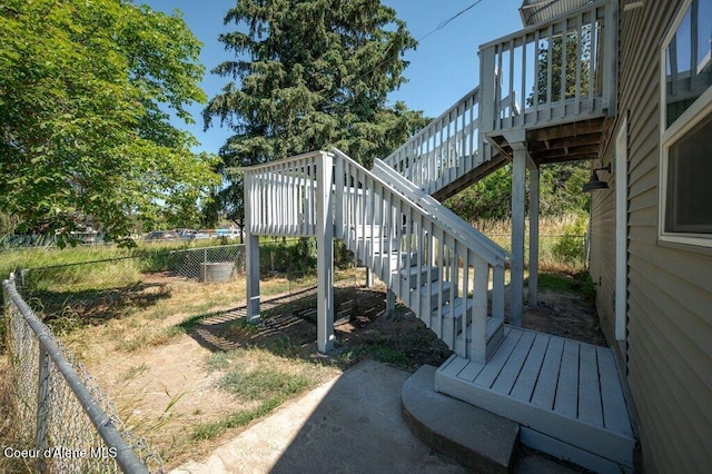9727 W E St, Worley, ID 83876 - fenced backyard with stairway and a wooden deck