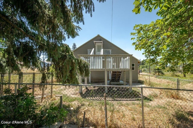 9727 W E St, Worley, ID 83876 - rear view of house featuring a deck, stairway, and a fenced backyard