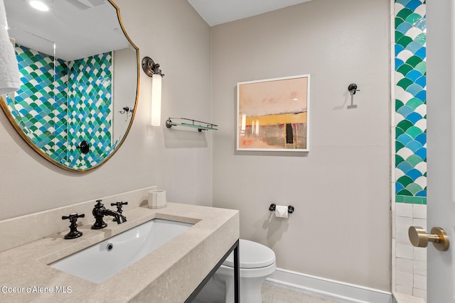 4797 S Arrow Point Dr # 102, Harrison, ID 83833 - full bath with toilet, baseboards, and a sink