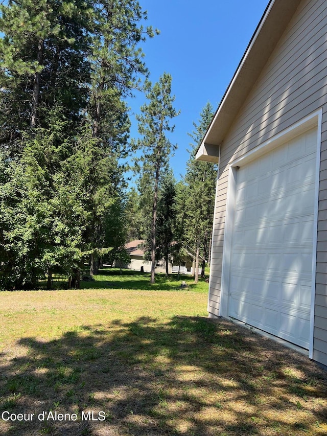 view of yard with a garage