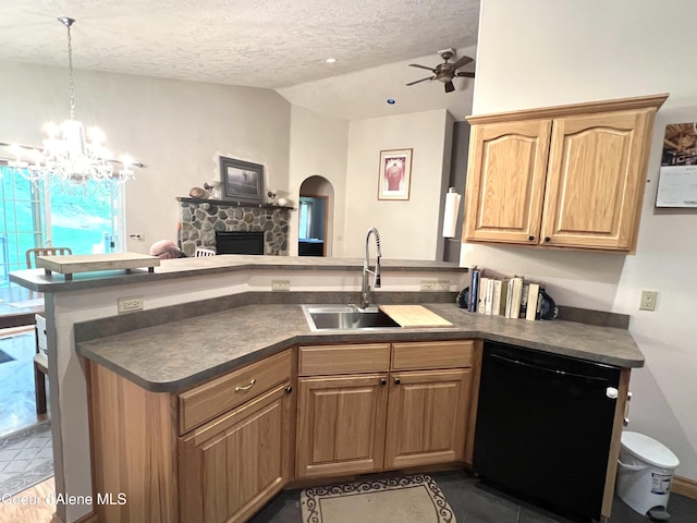 927 Bear Claw Rd, Clark Fork, ID 83811 - kitchen with dishwasher, lofted ceiling, a sink, dark countertops, and a peninsula