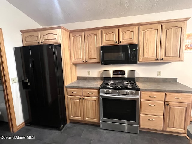 927 Bear Claw Rd, Clark Fork, ID 83811 - kitchen featuring black appliances, dark countertops, light brown cabinets, and dark tile patterned flooring