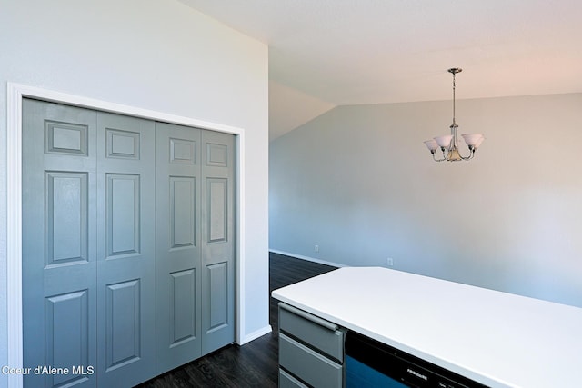8102 W Arizona St, Rathdrum, ID 83858 - kitchen with a chandelier, lofted ceiling, dark wood finished floors, pendant lighting, and light countertops