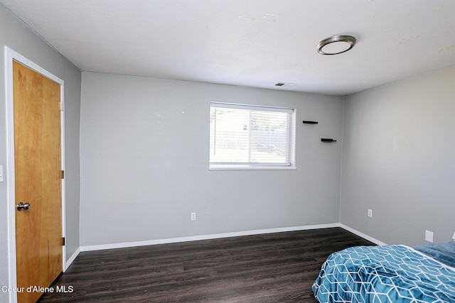8102 W Arizona St, Rathdrum, ID 83858 - bedroom with wood finished floors and baseboards