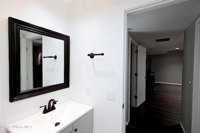 8102 W Arizona St, Rathdrum, ID 83858 - bathroom with vanity and wood finished floors