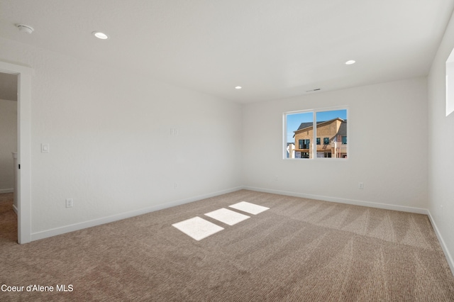 6760 Portrush Dr, Rathdrum, ID 83858 - spare room with baseboards, light carpet, and recessed lighting