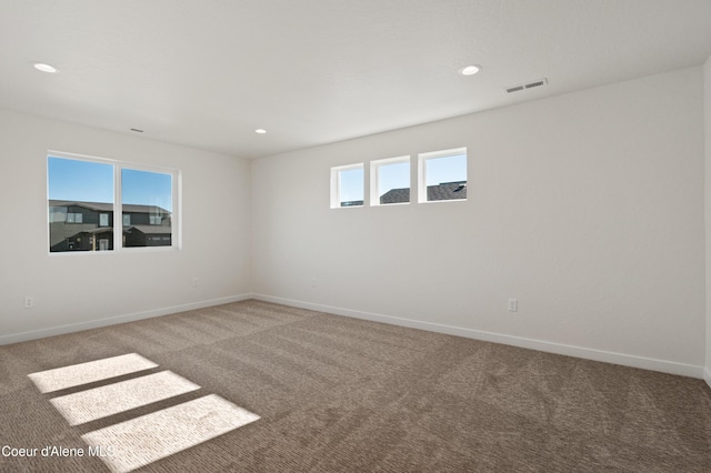 6760 Portrush Dr, Rathdrum, ID 83858 - unfurnished room featuring carpet, visible vents, and baseboards