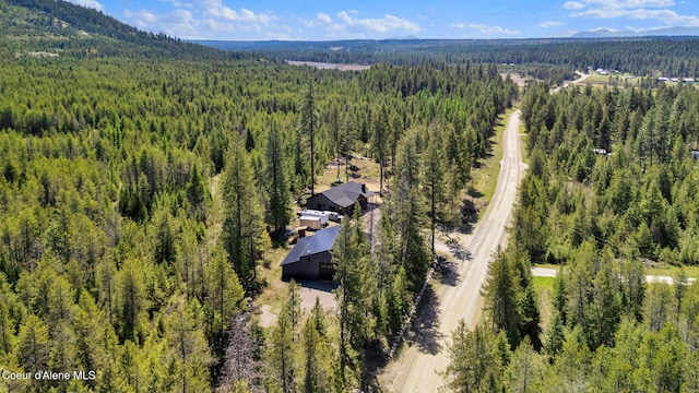 aerial view with a forest view and a mountain view