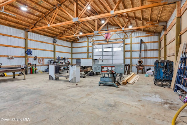 garage featuring a workshop area and metal wall