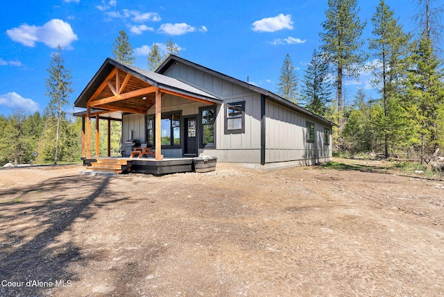 exterior space with covered porch and board and batten siding