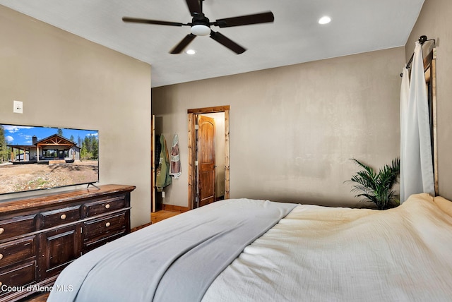 bedroom with ceiling fan, recessed lighting, and wood finished floors