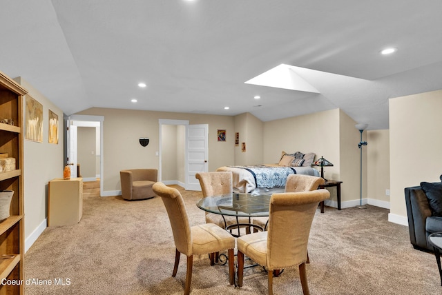 1315 N 10th St, Coeur Dalene, ID 83814 - dining space featuring light colored carpet, a skylight, lofted ceiling, recessed lighting, and baseboards