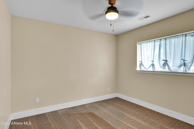 1315 N 10th St, Coeur Dalene, ID 83814 - spare room featuring dark colored carpet, baseboards, and ceiling fan